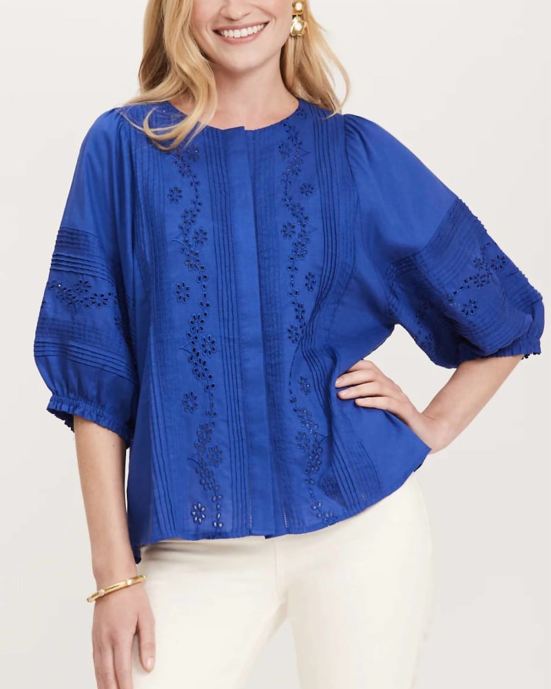 Front of a model wearing a size L Embroidered Puff Sleeve Blouse in Cobalt in Cobalt by Tyler Boe. | dia_product_style_image_id:336011